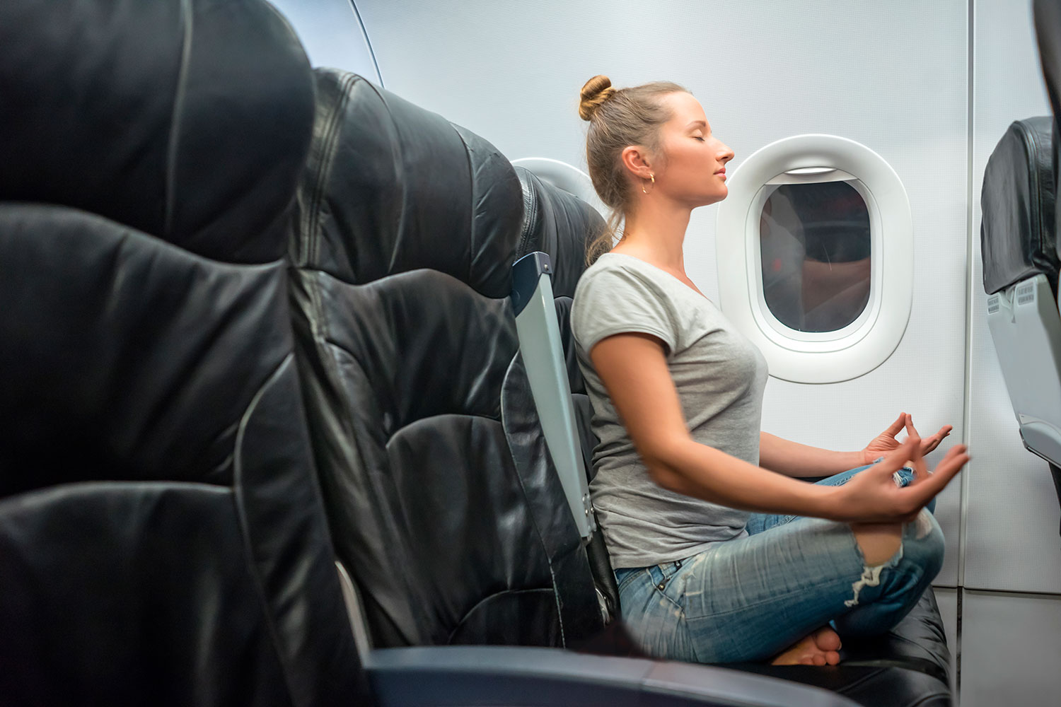 5 Ways to Do Yoga While Traveling by Bus, Train, or Plane