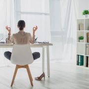 12 Yoga Poses You Can Do at Your Work Desk to Relieve Stress