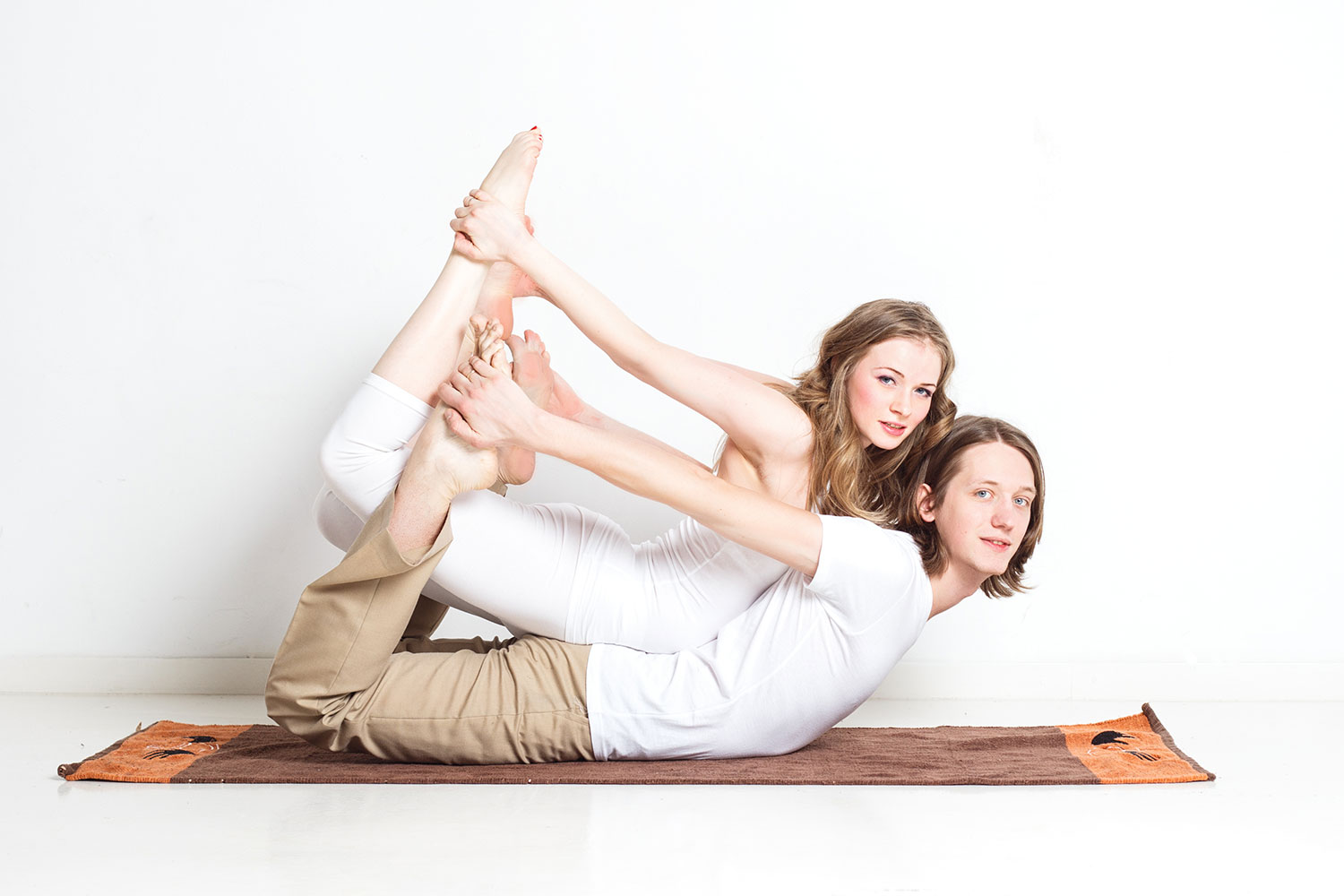 Beautiful and Young Woman with Curly Hair and a Man Doing Selfie on Yoga  Mat in Floor. the Concept of Yoga in a Stock Photo - Image of partner,  girl: 159996896