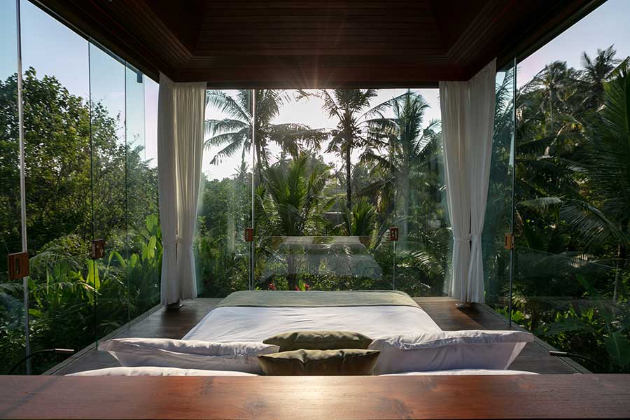 beautiful-garden-setting-glass-walls-bedroom-ubud-bali-resorts