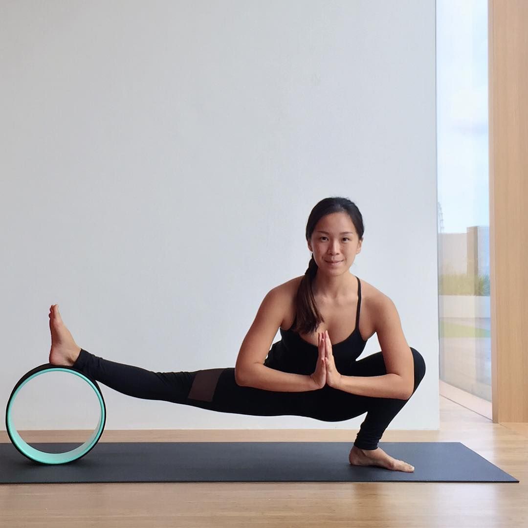 yoga wheel stock photos - OFFSET