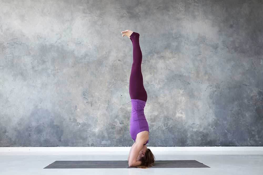 How to Do the Headstand Pose in Yoga Without Kicking Your Way Up | SELF