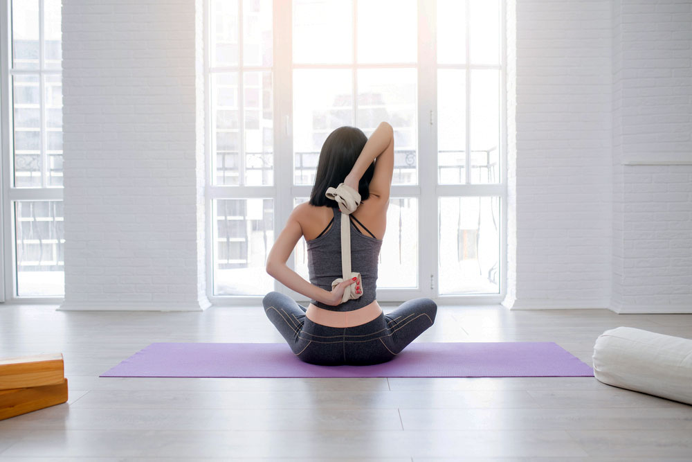 How to Use a Yoga Strap to Open Shoulders - Prime Women Media