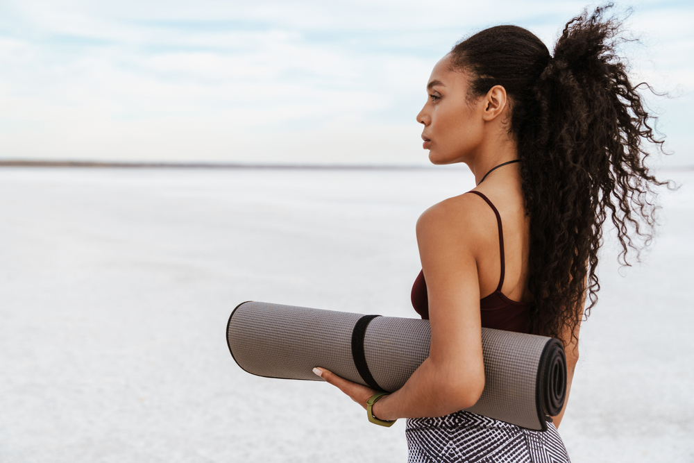 How to Use a Yoga Strap to Carry Your Mat