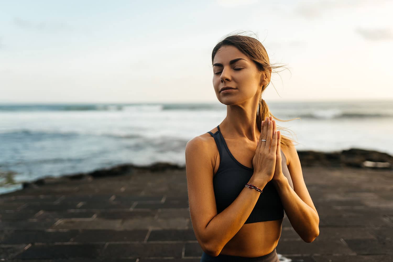 muladhara swadhisthana manipula tantra yoga on the beach woman