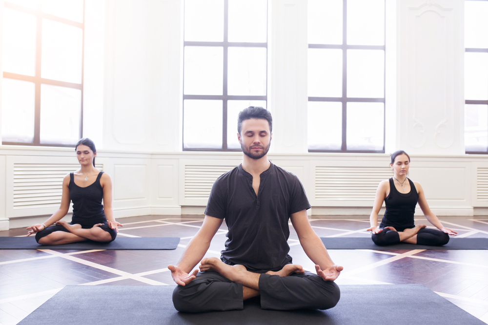 Woman in the yoga pose. Yoga icon. Meditation. Lotus position. Infinity.  Stock Vector | Adobe Stock